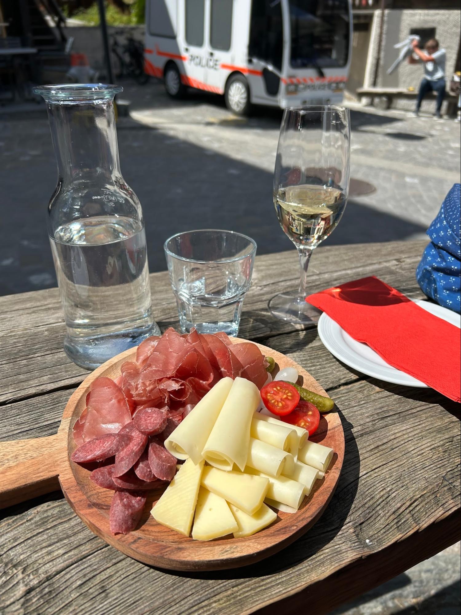 A charcuterie board and wine, Molly's Maps Italy and Switzerland travel guide