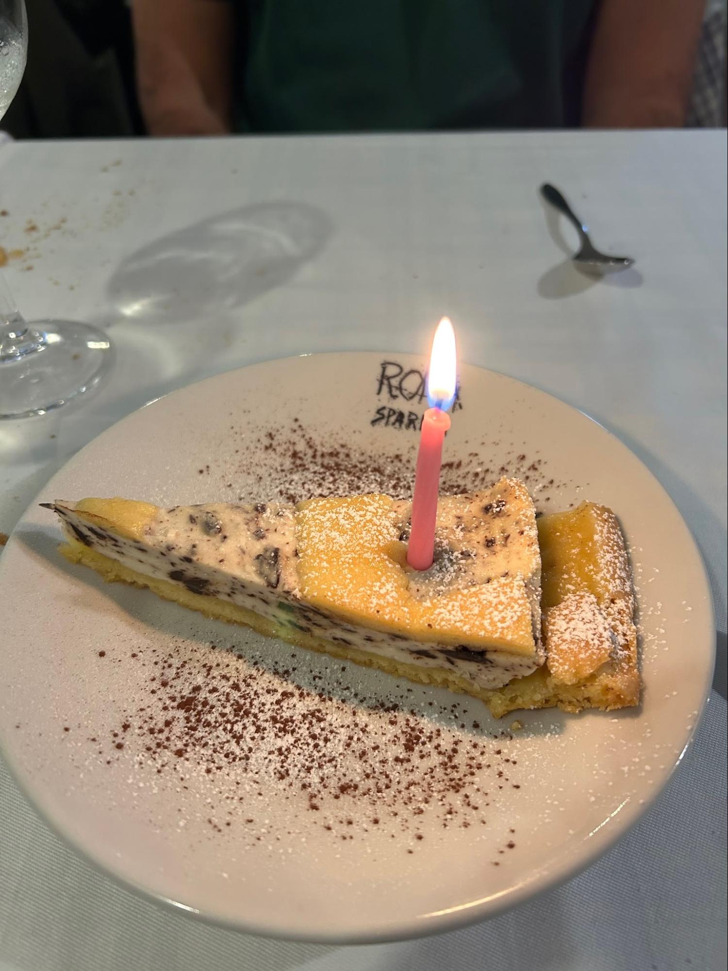 Tiramisu dessert with a birthday candle in Italy, Molly's Maps